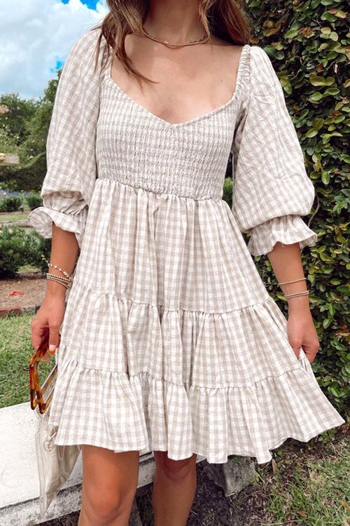 Babydoll jurk met ruitpatroon en smockdetail ideaal voor een speelse en stijlvolle uitstraling