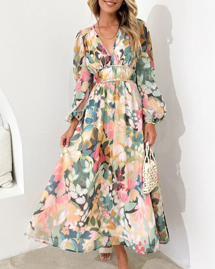 Elegante lange jurk met bloemenprint en ballonmouwen