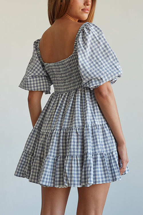 Babydoll jurk met ruitpatroon en smockdetail ideaal voor een speelse en stijlvolle uitstraling
