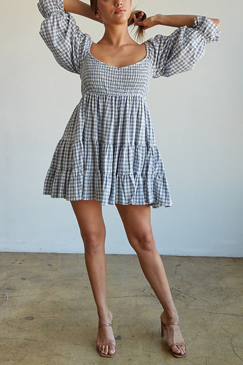 Babydoll jurk met ruitpatroon en smockdetail ideaal voor een speelse en stijlvolle uitstraling