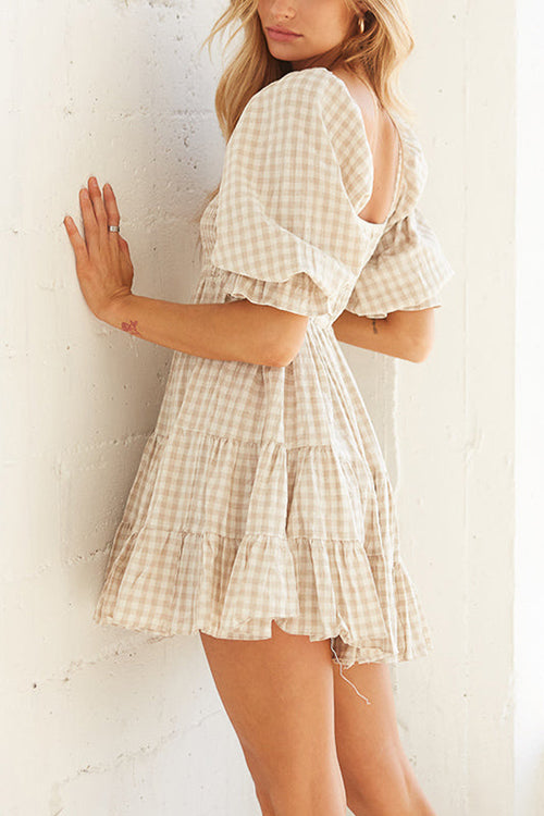 Babydoll jurk met ruitpatroon en smockdetail ideaal voor een speelse en stijlvolle uitstraling
