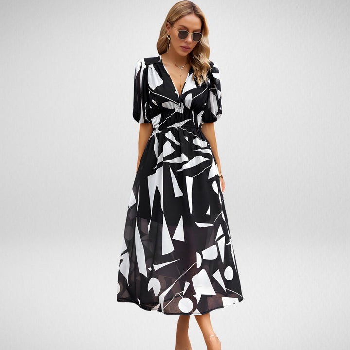 Midi jurk met geometrisch patroon en korte lanternmouwen