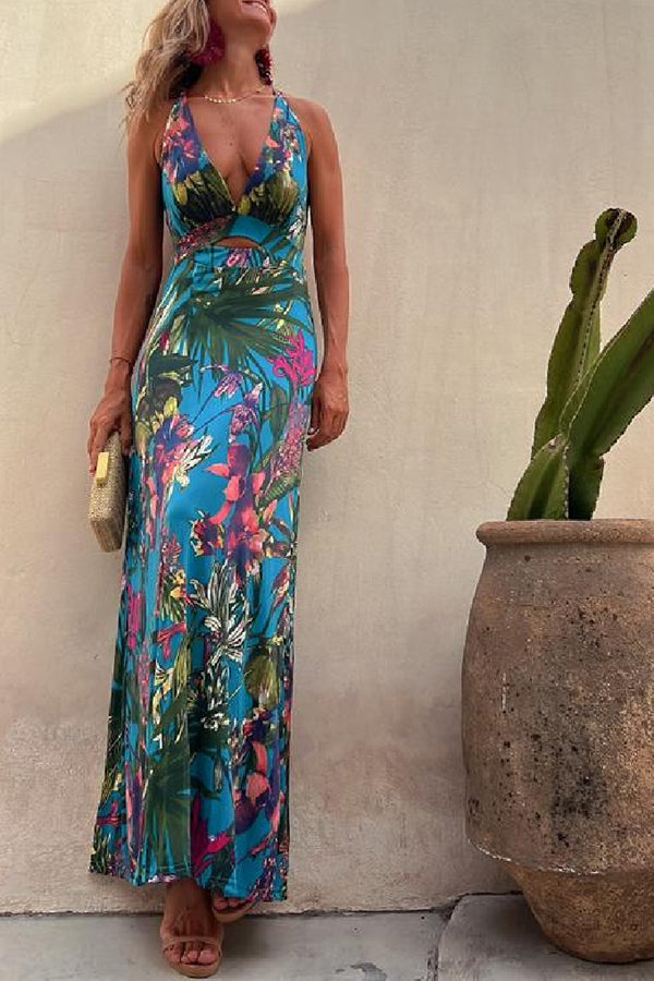 Lange crossover jurk met tropische print en open rug perfect voor zomerse gelegenheden