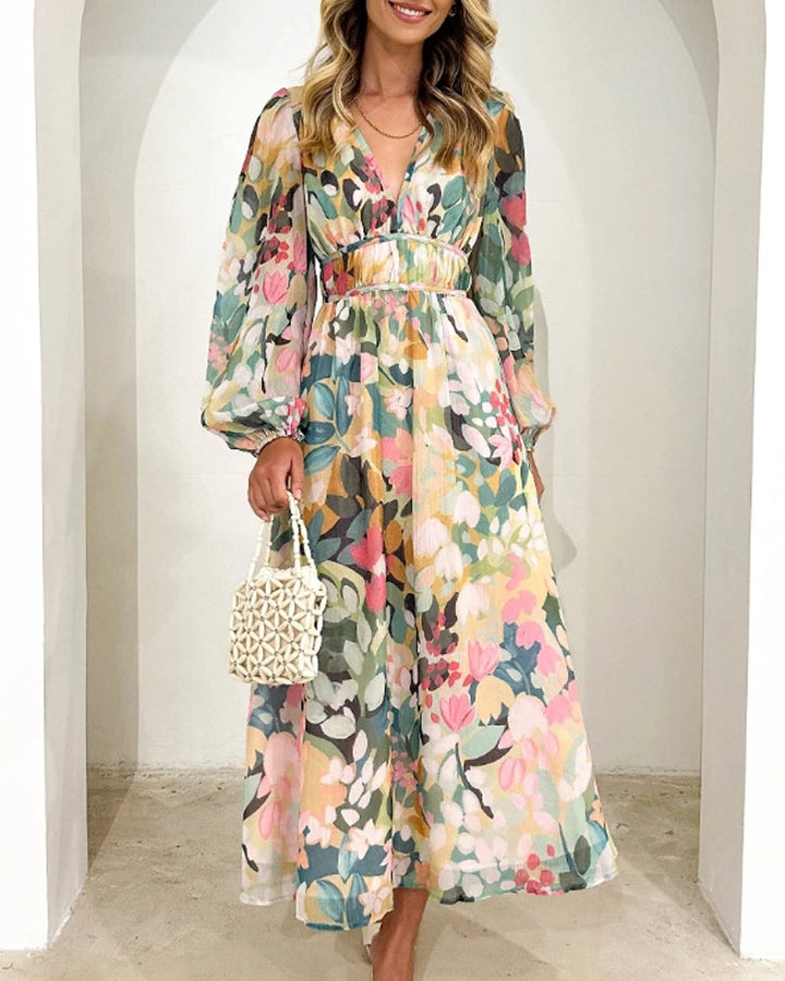 Elegante lange jurk met bloemenprint en ballonmouwen