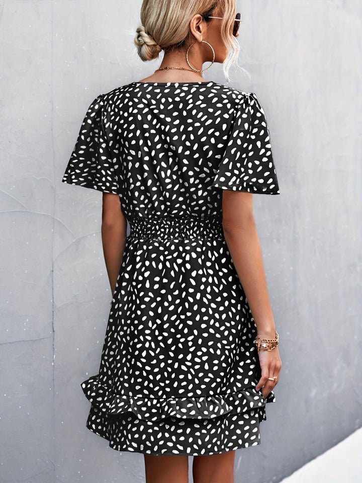 Damesjurk met stippenprint en elegante ruches mouwen