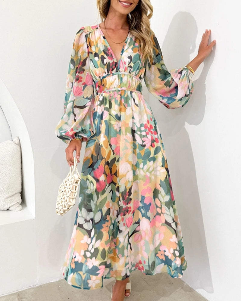 Elegante lange jurk met bloemenprint en ballonmouwen
