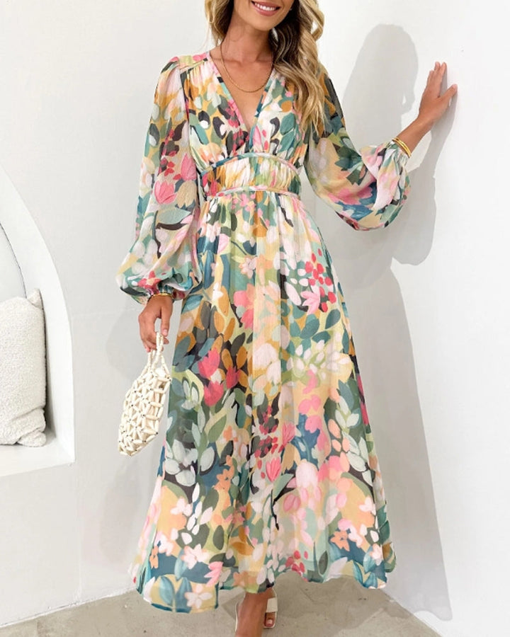 Elegante lange jurk met bloemenprint en ballonmouwen