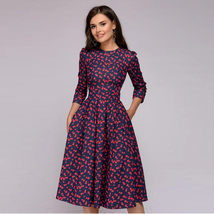 Stijlvolle midi-jurk met wijde rok en bloemenpatroon voor een elegante uitstraling